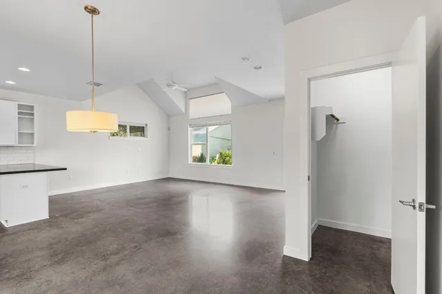 a kitchen with granite countertop a stove and a sink