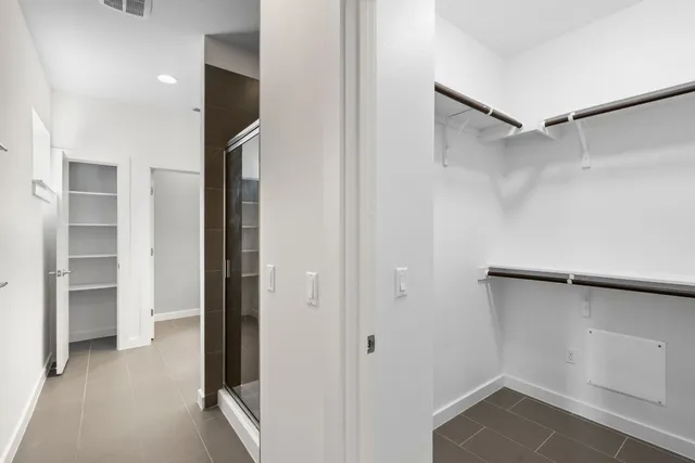 a view of a hallway with washer and dryer