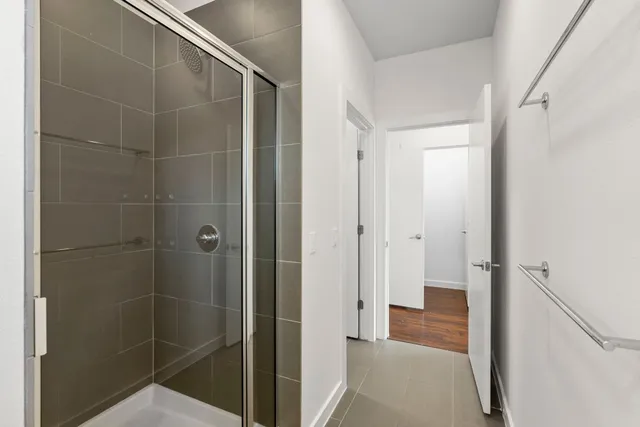 a view of a hallway with washer and dryer