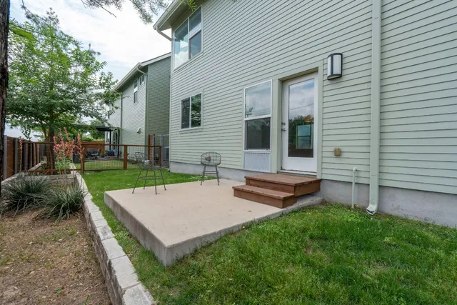 a view of a backyard with sitting area