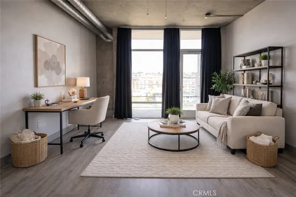 a living room with furniture and a window