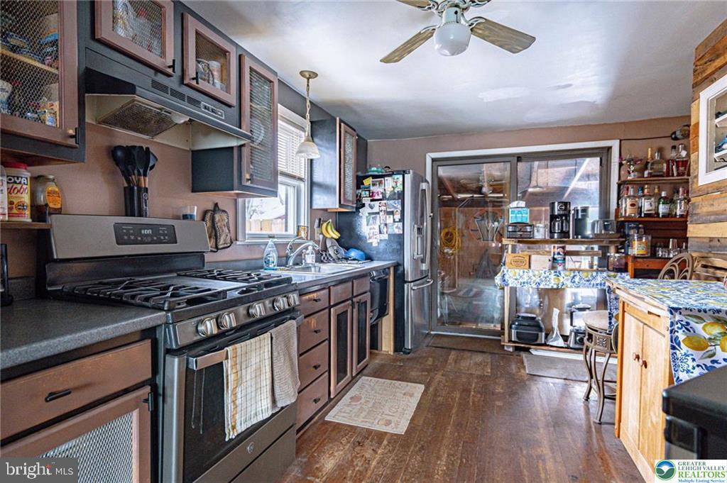 2303 South Filbert Street Allentown, PA 18103 - Photo 11 of 61 a kitchen with stainless steel appliances granite countertop a stove and a refrigerator