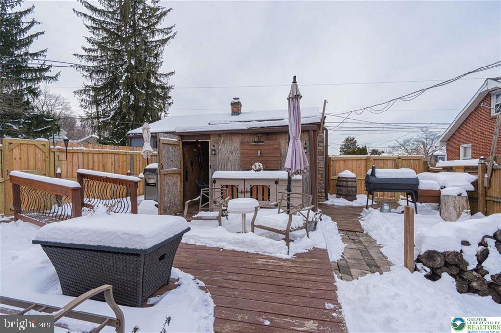 2303 South Filbert Street Allentown, PA 18103 - Photo 33 of 61 a view of a patio with table and chairs potted plants with wooden floor