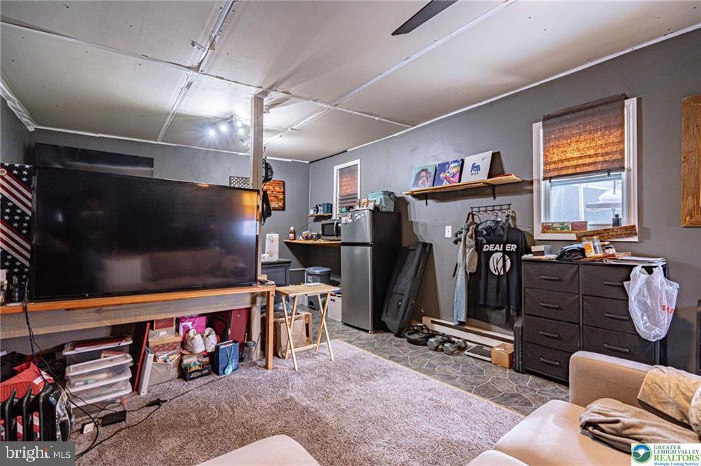 2303 South Filbert Street Allentown, PA 18103 - Photo 38 of 61 a room with gym equipment and a flat screen tv