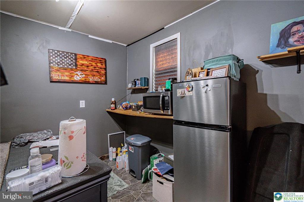 2303 South Filbert Street Allentown, PA 18103 - Photo 41 of 61 a kitchen with stainless steel appliances granite countertop a refrigerator and a sink