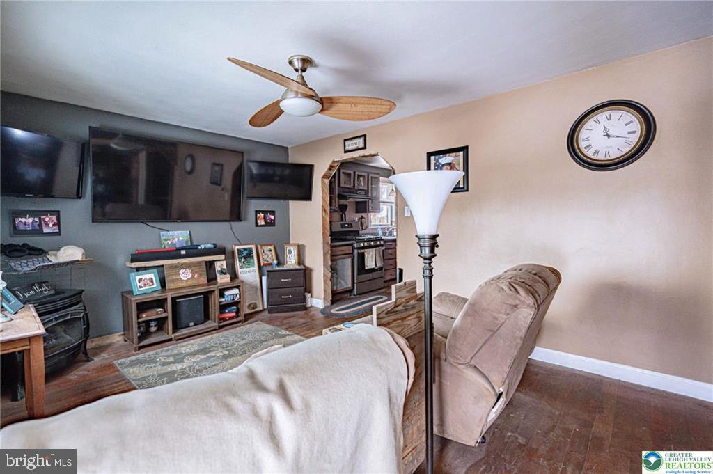 2303 South Filbert Street Allentown, PA 18103 - Photo 5 of 61 a view of a livingroom with furniture and a ceiling fan