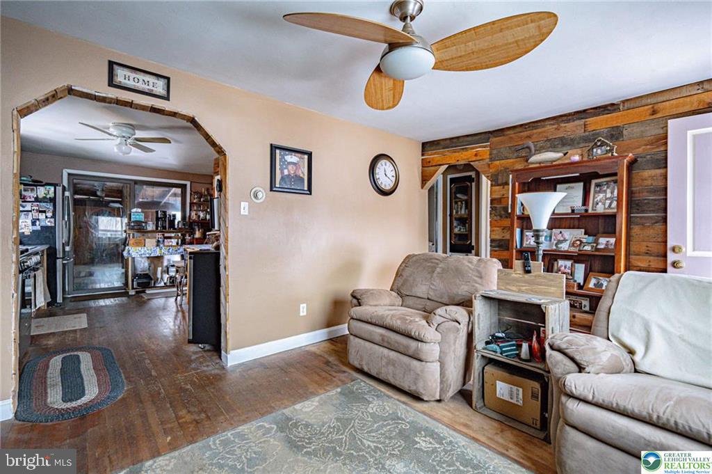 2303 South Filbert Street Allentown, PA 18103 - Photo 9 of 61 a living room with furniture ceiling fan and a rug