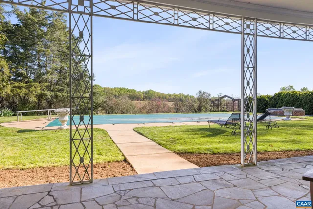 a view of a swimming pool and an outdoor space