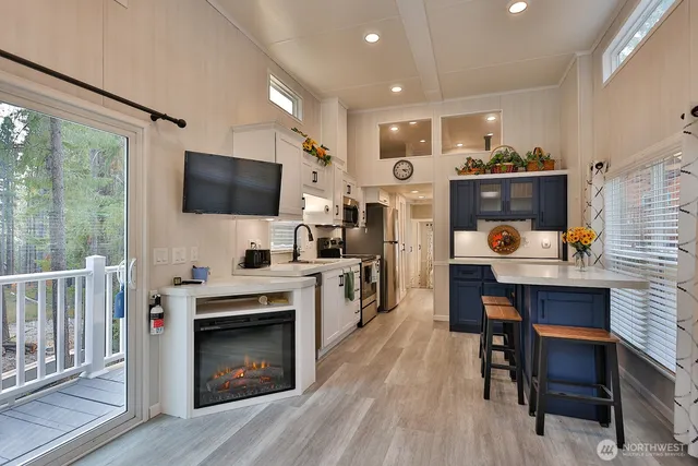 a kitchen with a sink appliances and cabinets