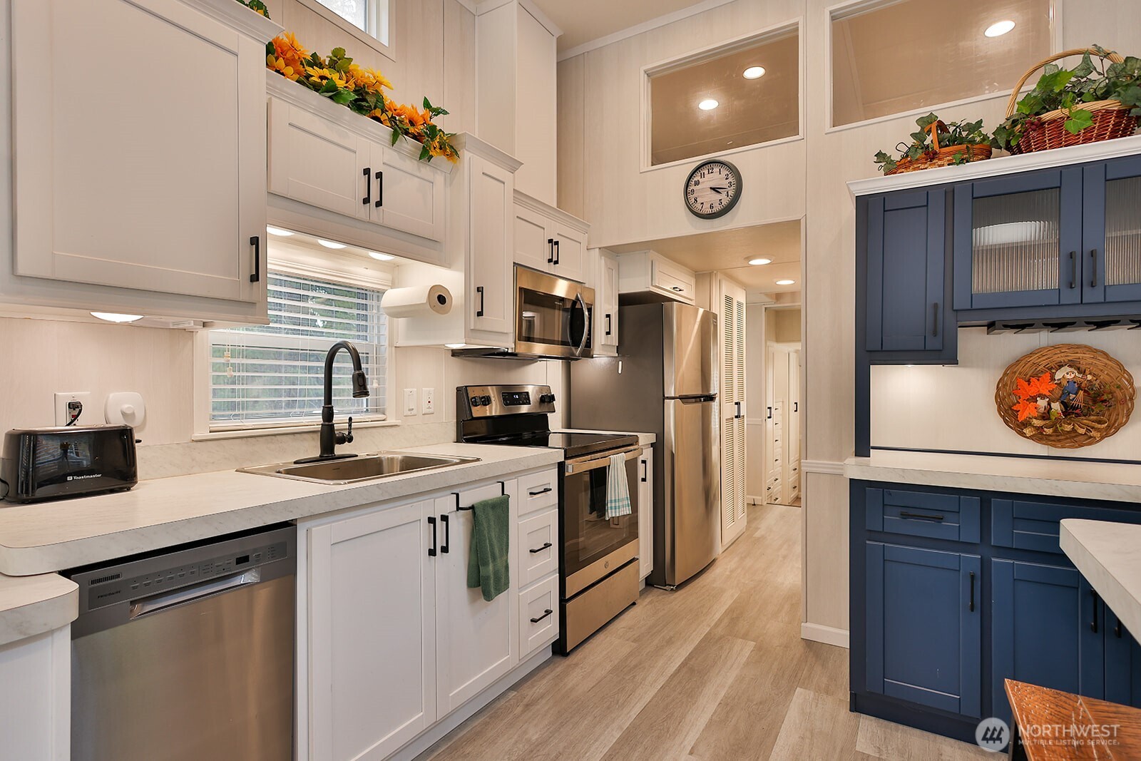 21512 Camp 12 Road Leavenworth, WA 98826 - Photo 5 of 40 a kitchen with stainless steel appliances a refrigerator a sink and a stove