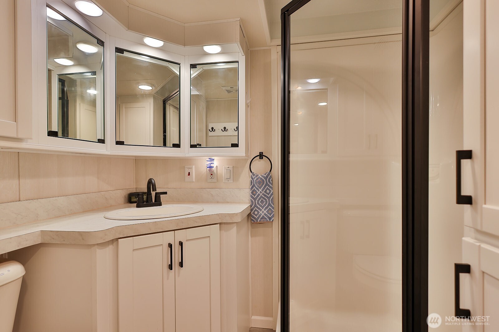 21512 Camp 12 Road Leavenworth, WA 98826 - Photo 9 of 40 a bathroom with a sink vanity and a mirror
