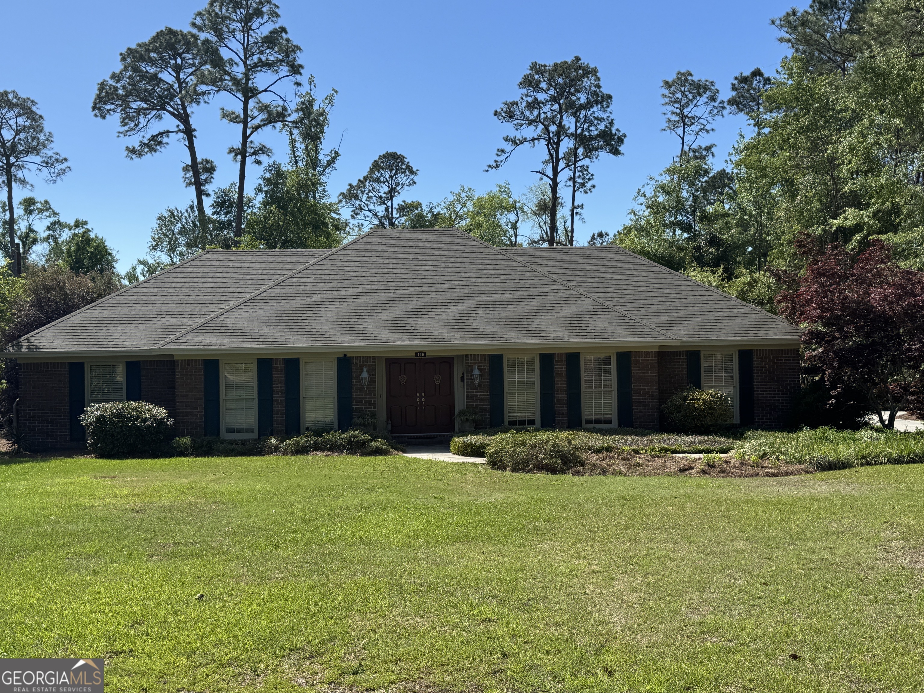 410 Preston Street Metter, GA 30439 - Photo 1 of 39 a front view of house with yard outdoor seating and green space