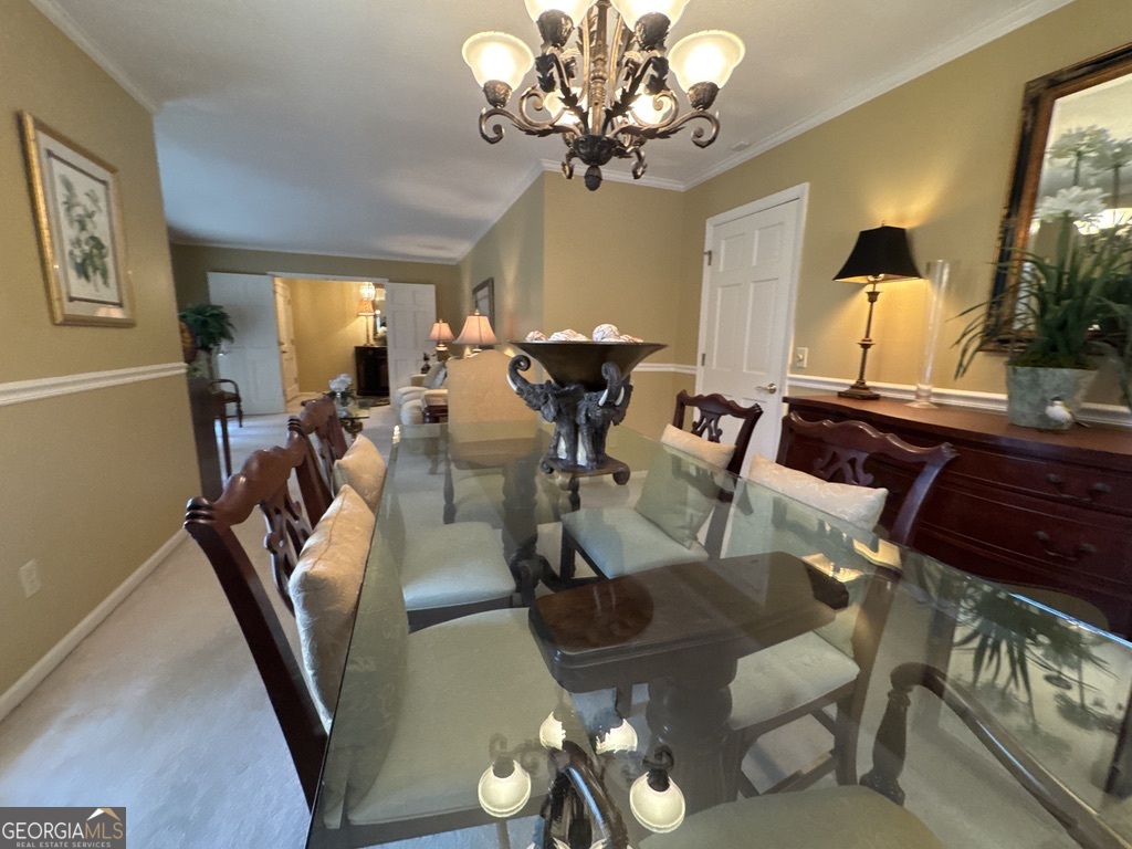 410 Preston Street Metter, GA 30439 - Photo 23 of 39 a view of a dining room with furniture and chandelier