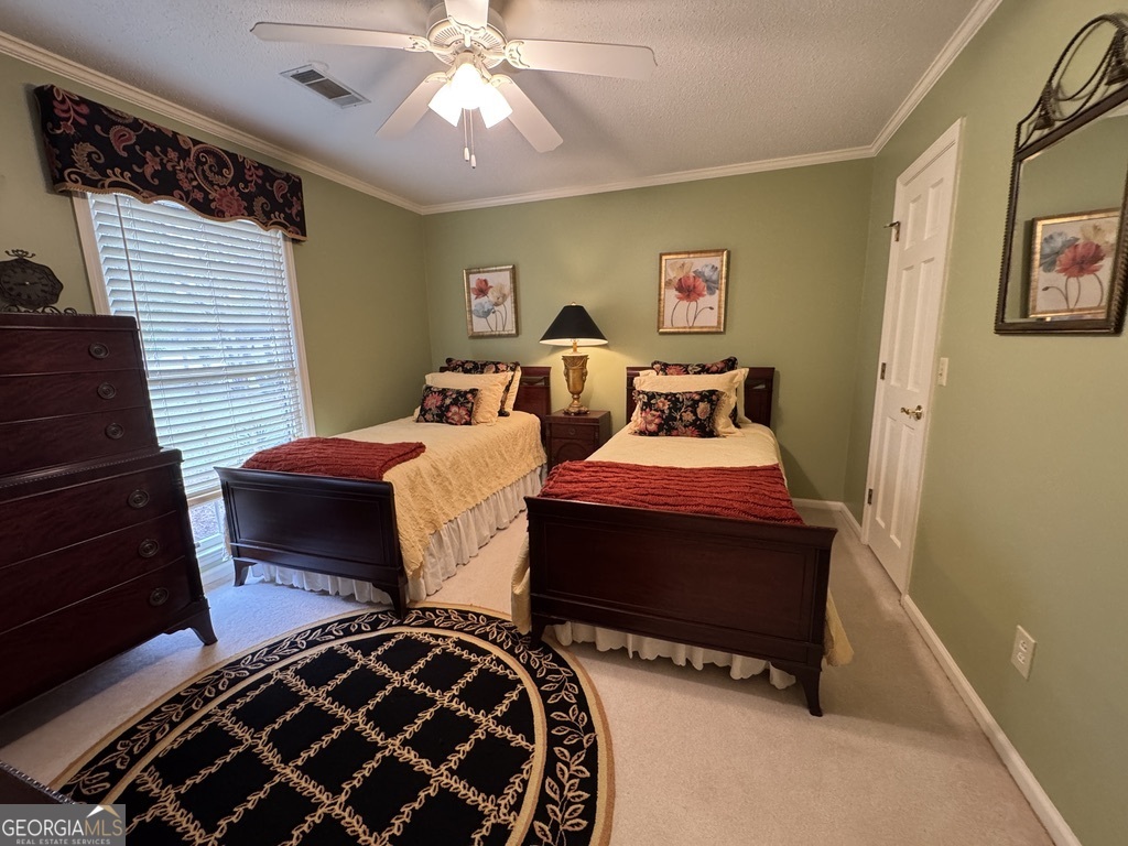 410 Preston Street Metter, GA 30439 - Photo 33 of 39 a bedroom with bed and wooden floor