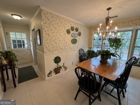 410 Preston Street Metter, GA 30439 - Photo 6 of 39 a view of a dining room with furniture and chandelier