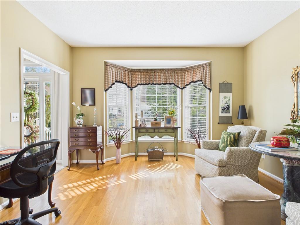 4212 Suffolk Trail Greensboro, NC 27407 - Photo 6 of 40 Open area between living room and den that provides a lot of space for entertaining