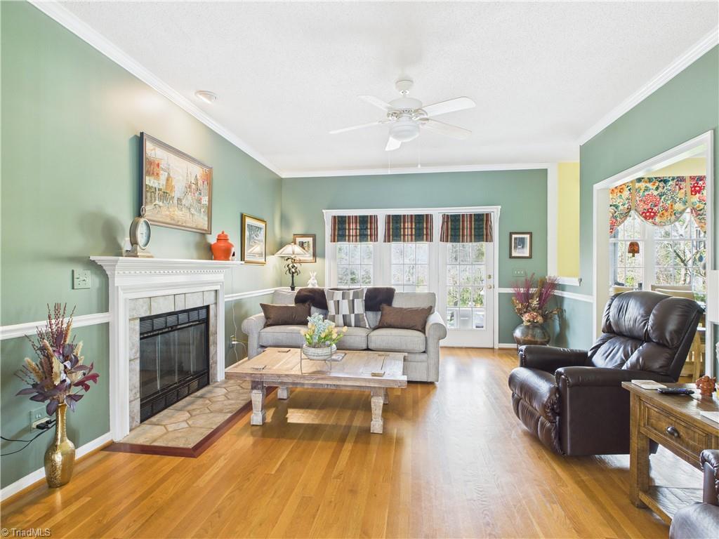 4212 Suffolk Trail Greensboro, NC 27407 - Photo 7 of 40 Fantastic den that looks out onto a double deck and natural area.