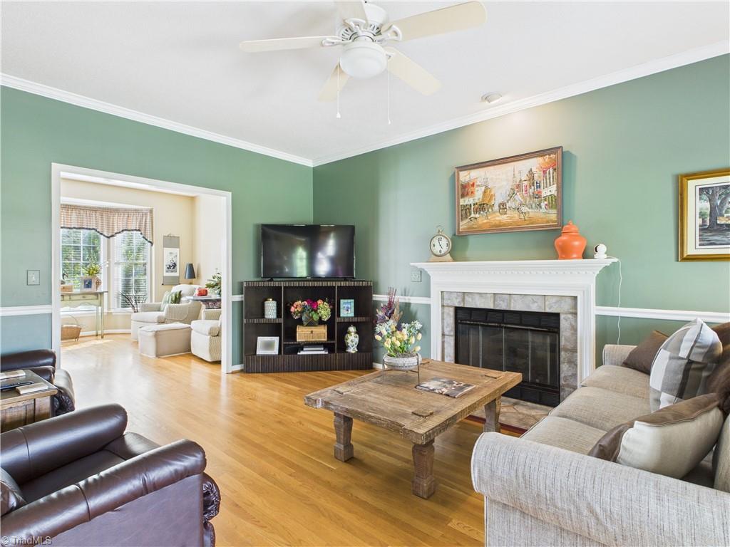 4212 Suffolk Trail Greensboro, NC 27407 - Photo 8 of 40 Den features a fireplace to warm up with when its cold.