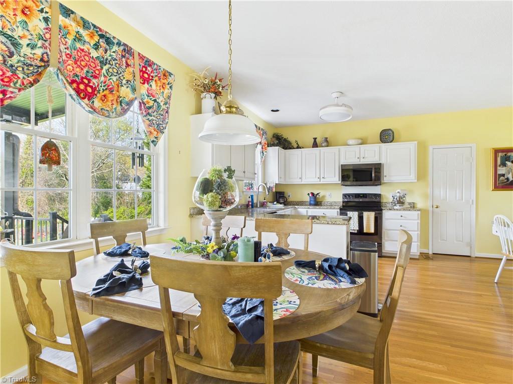 4212 Suffolk Trail Greensboro, NC 27407 - Photo 9 of 40 Nice dining area open to the kitchen and den.