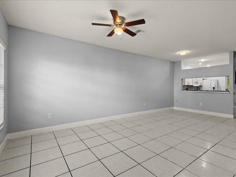 29924 Playa Del Rey Lane Wesley Chapel, FL 33543 - Photo 8 of 31 a view of an empty room and kitchen view