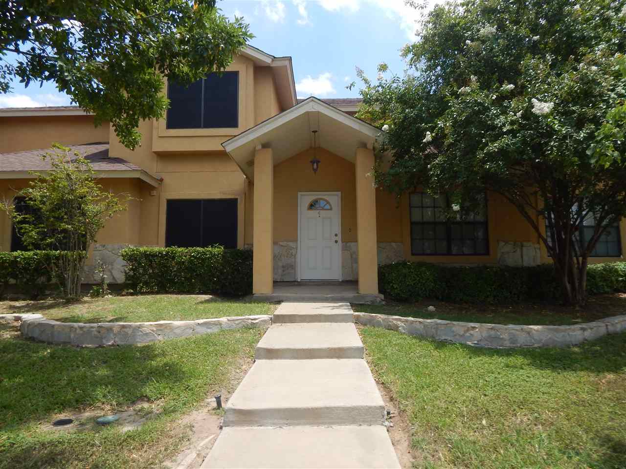 1602 Jacaman Road, Unit 4 Laredo, TX 78041 - Photo 1 of 9 a front view of a house with garden