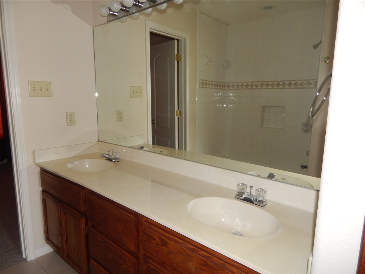 1602 Jacaman Road, Unit 4 Laredo, TX 78041 - Photo 9 of 9 a bathroom with a granite countertop sink and a mirror