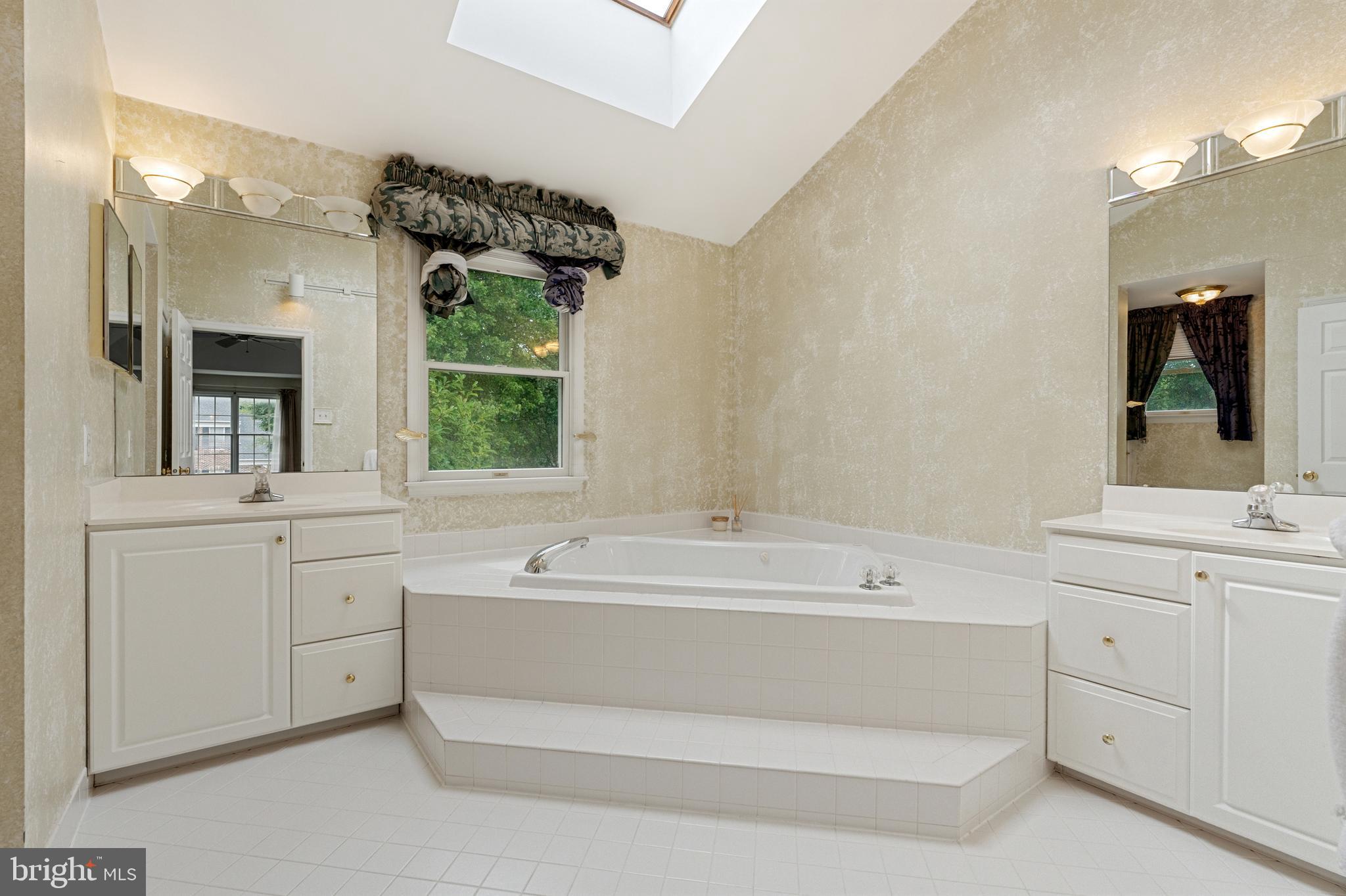 4913 Mead Drive Doylestown, PA 18902 - Photo 23 of 41 a bathroom with a sink mirror and a bathtub