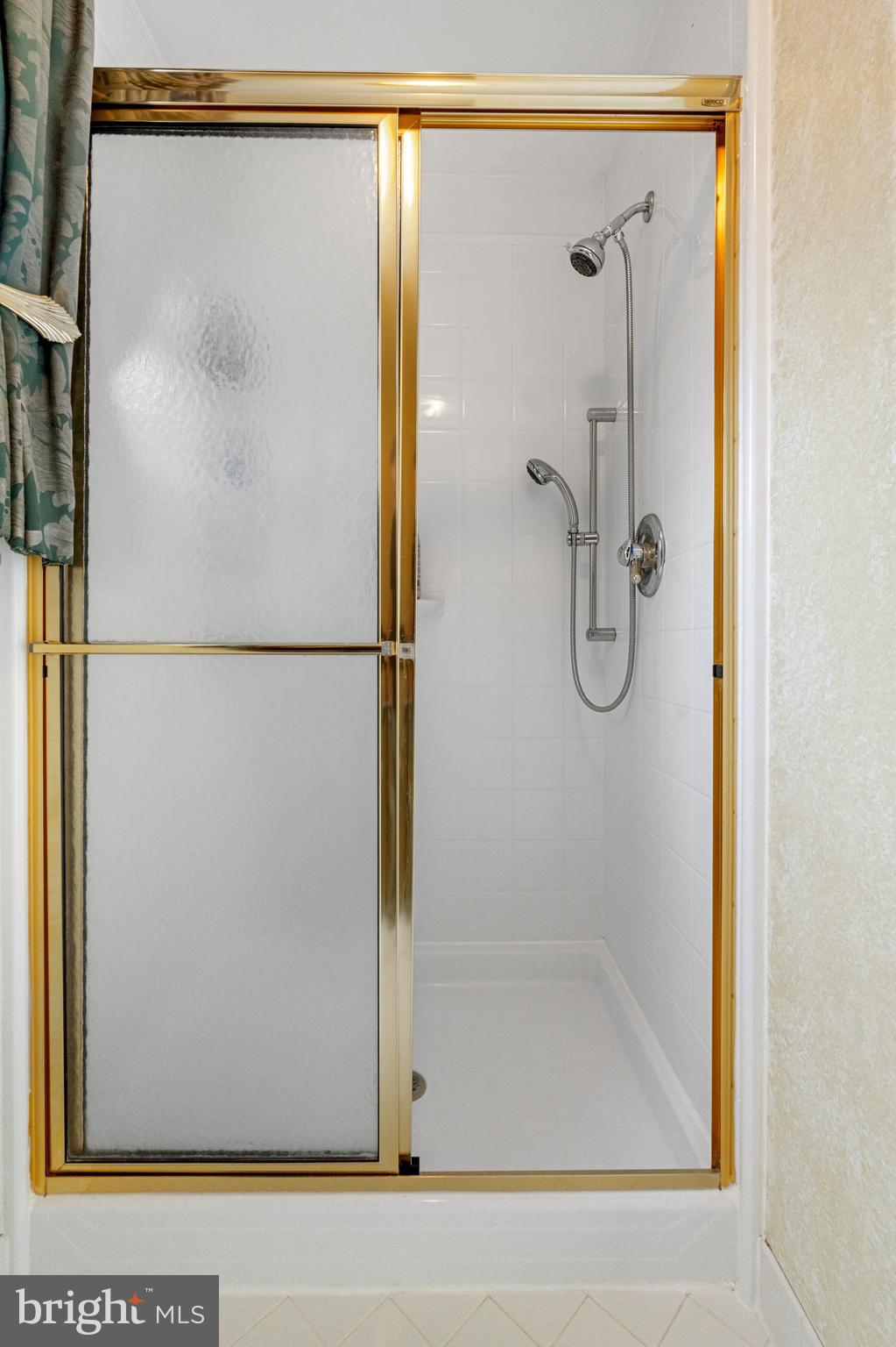 4913 Mead Drive Doylestown, PA 18902 - Photo 25 of 41 a bathroom with a shower and a glass door