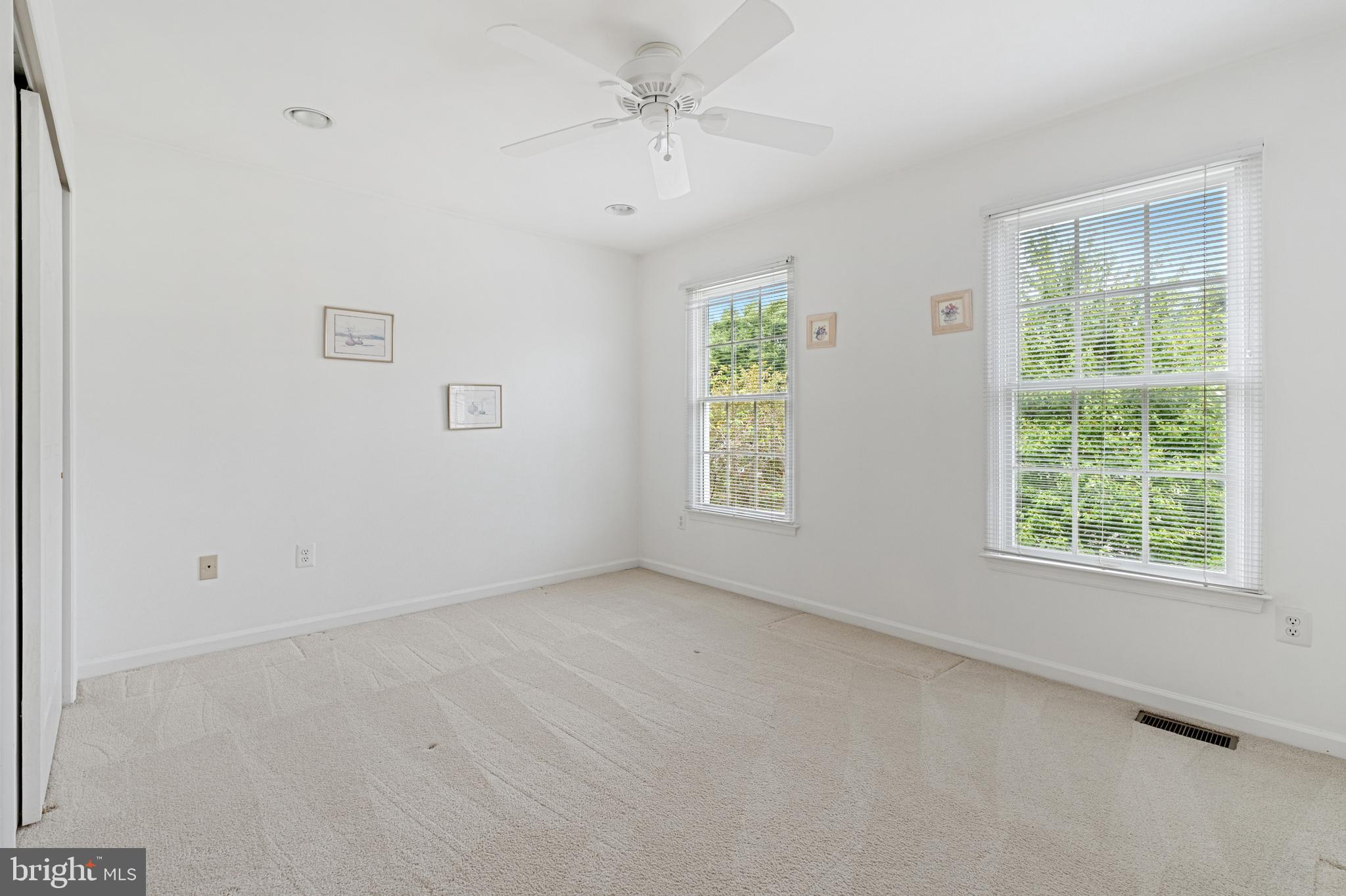 4913 Mead Drive Doylestown, PA 18902 - Photo 26 of 41 an empty room with a window and a ceiling fan