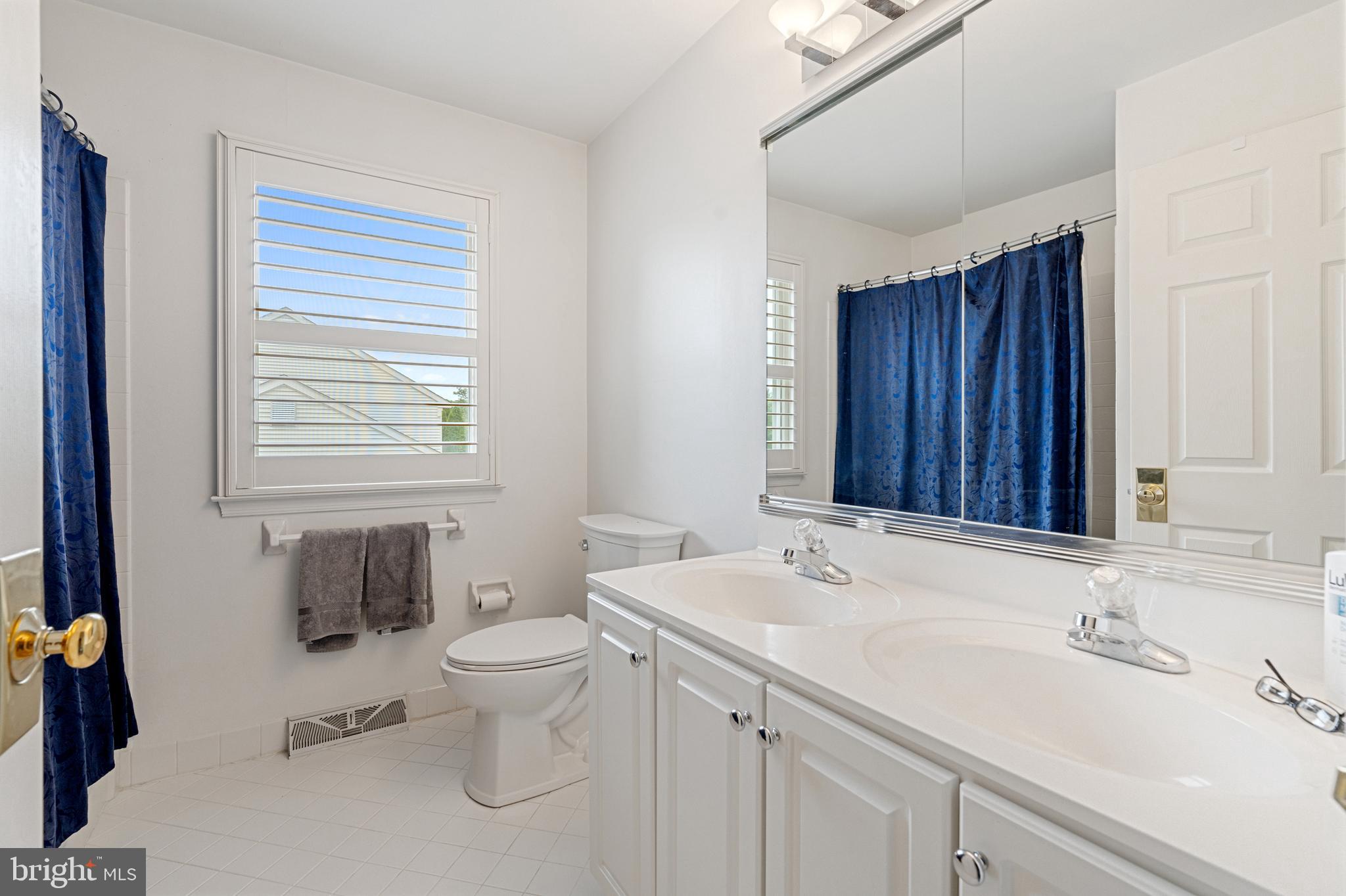 4913 Mead Drive Doylestown, PA 18902 - Photo 30 of 41 a bathroom with a sink and a toilet