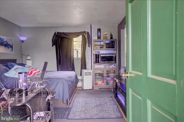 a bathroom with a sink mirror vanity and toilet