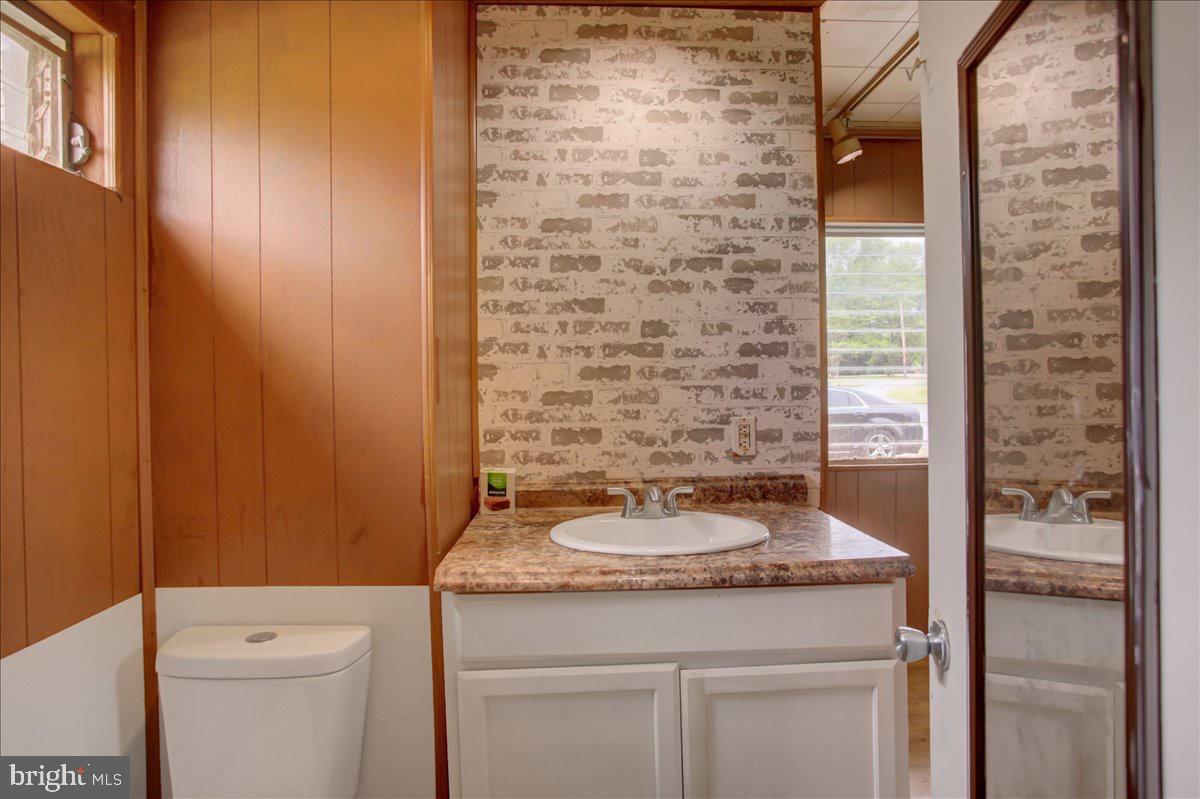 12494 Path Valley Road Willow Hill, PA 17271 - Photo 26 of 32 a bathroom with a granite countertop sink and a toilet