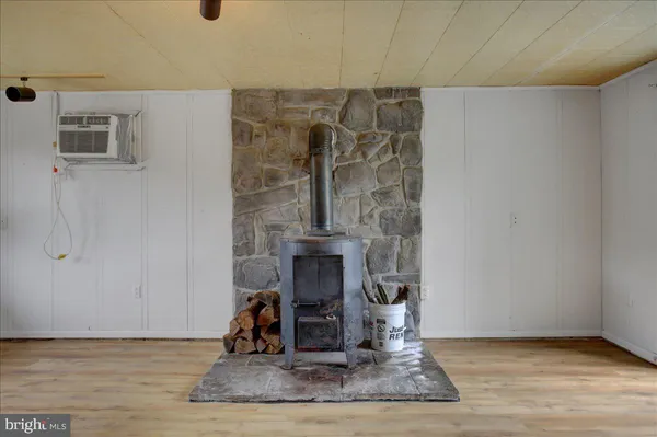 a view of workspace with wooden floor windows