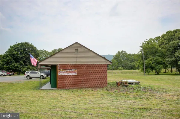 a view of a house with a yard and garage