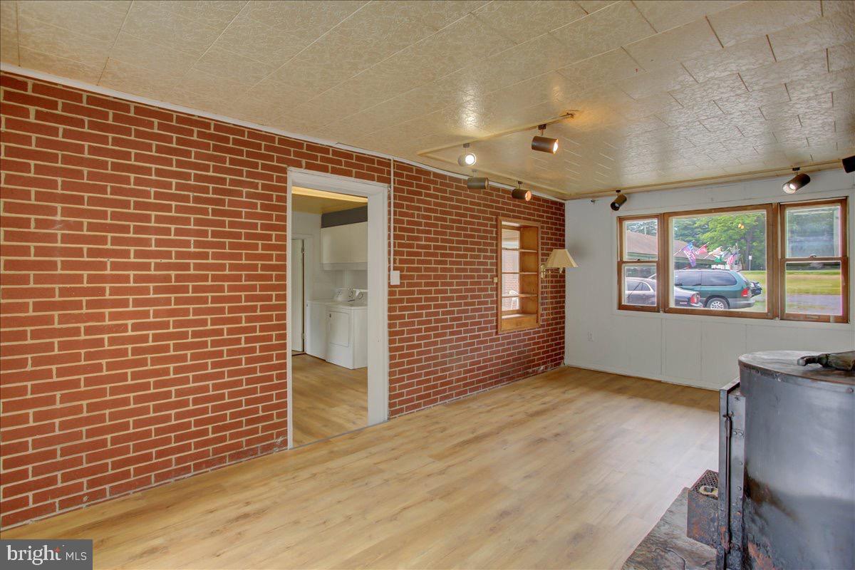 12494 Path Valley Road Willow Hill, PA 17271 - Photo 31 of 32 a view of an empty room with wooden floor and a window