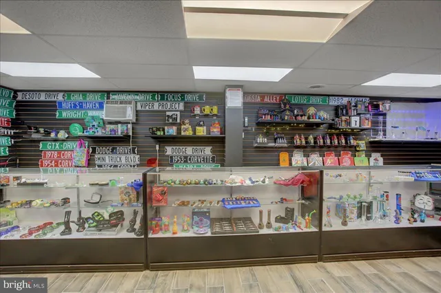 a kitchen area with stainless steel appliances table and chairs