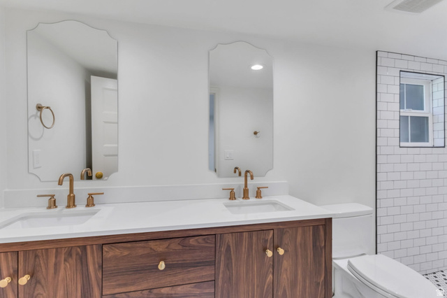 226 North 300 West Provo, UT 84601 - Photo 13 of 14 Dual vanity featuring wood-finish cabinetry, white countertops, and contemporary gold-toned fixtures