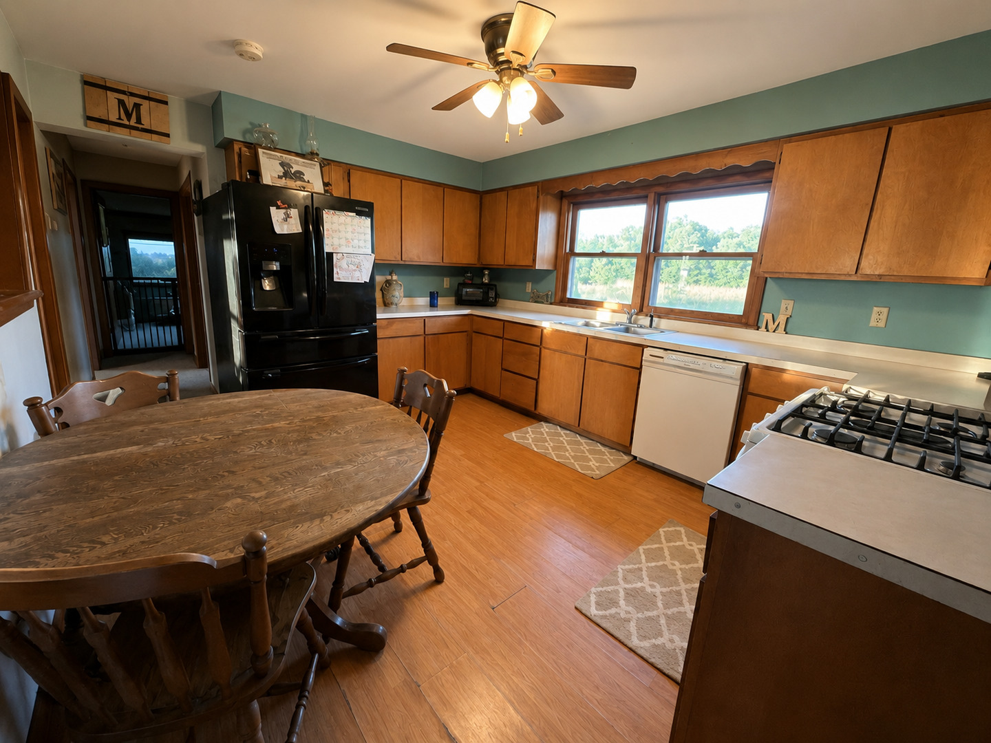 0 North 1900th Street Mount Carmel, IL 62863 - Photo 17 of 50 a kitchen with stainless steel appliances a dining table chairs stove and sink