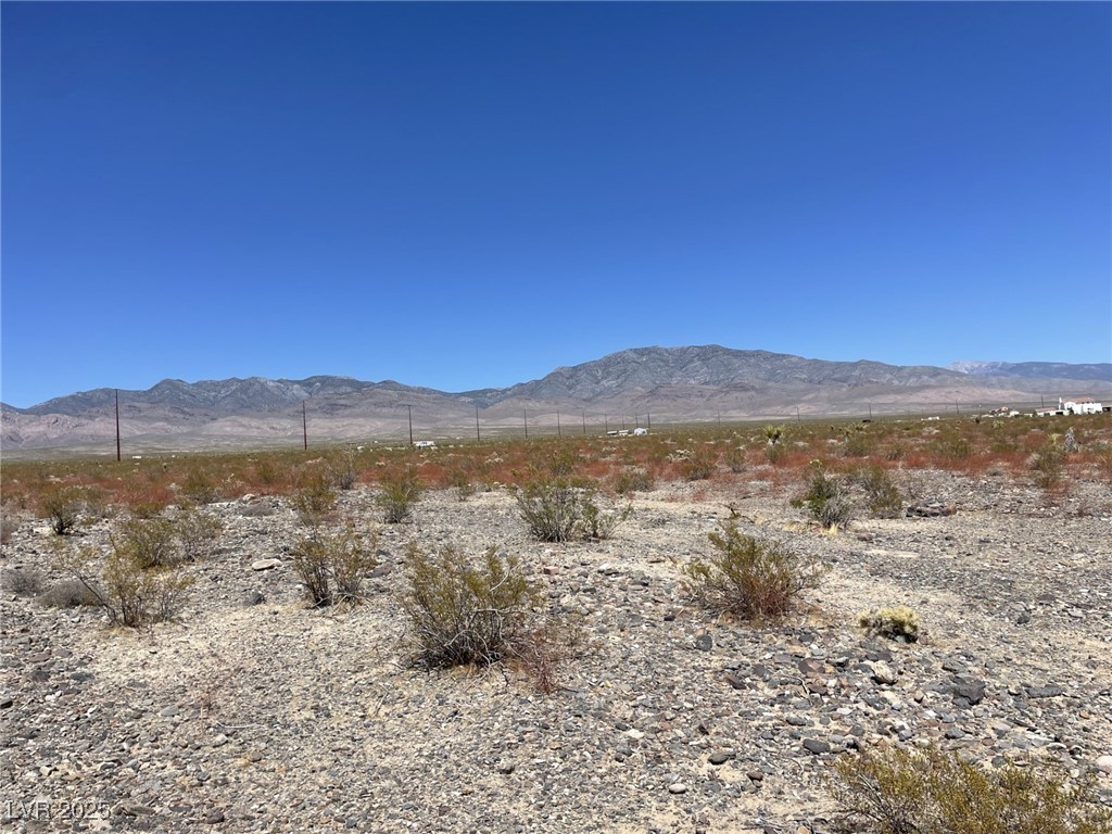 7030 North Koala Road Pahrump, NV 89060 - Photo 2 of 9 View of mountain background featuring a desert landscape