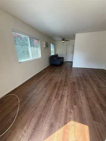 a view of kitchen and wooden floor