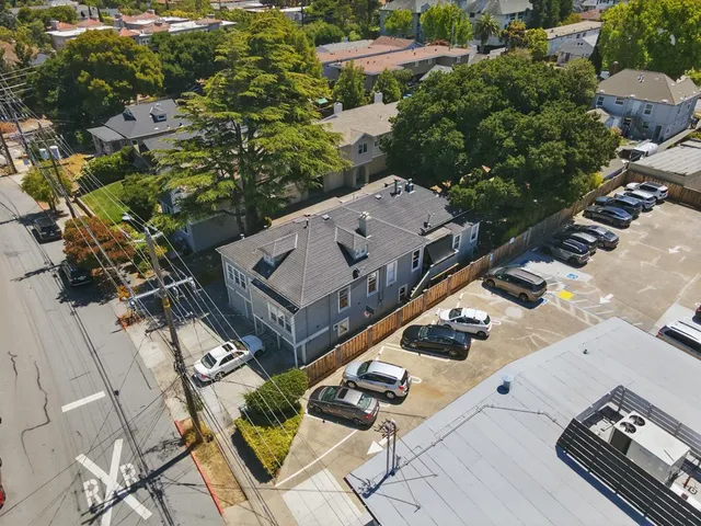 an aerial view of a house with outdoor space
