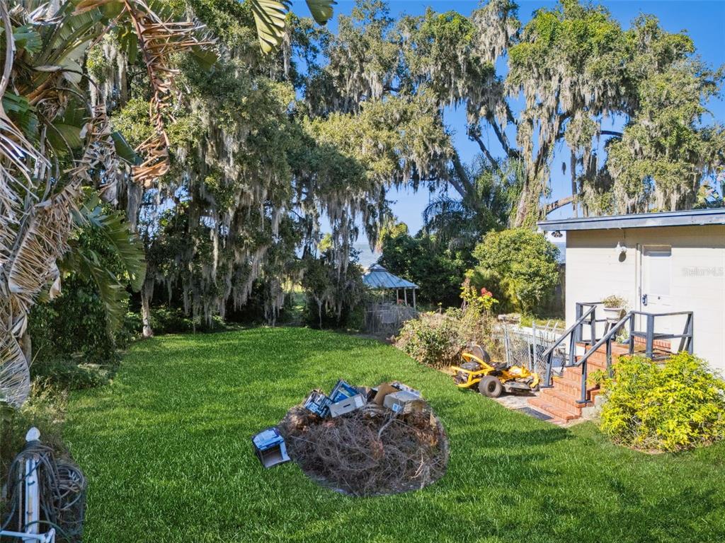 3828 Walker Road Apopka, FL 32703 - Photo 24 of 34 a view of a chair and table of the garden