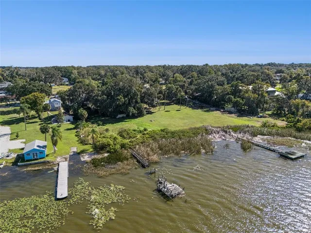 a view of a street with a yard