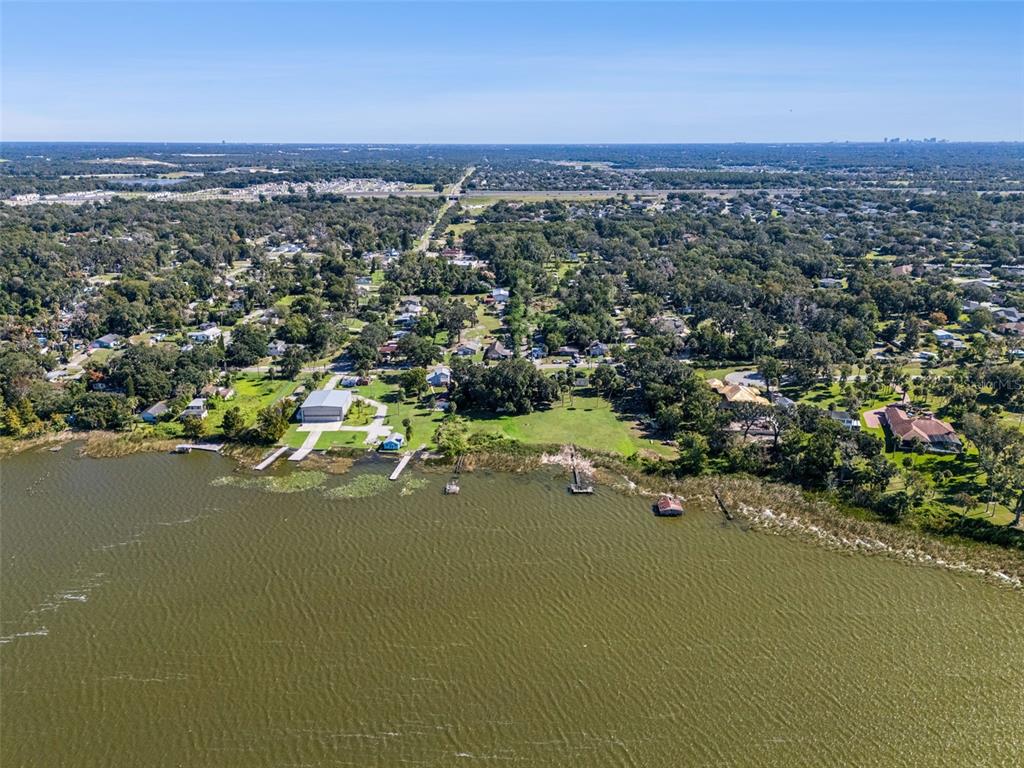 3828 Walker Road Apopka, FL 32703 - Photo 33 of 34 an aerial view of a houses with a yard and lake view