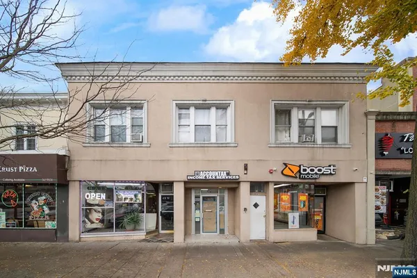 a front view of a building with street