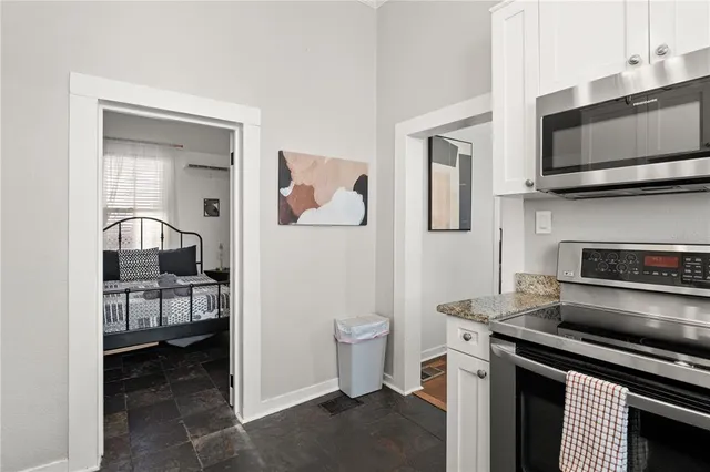 a kitchen with a sink and a stove top oven