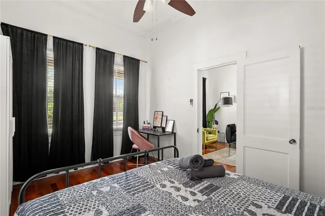 a bedroom with a bed a couch and a walk in closet