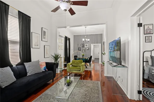 a living room with furniture fireplace and flat screen tv