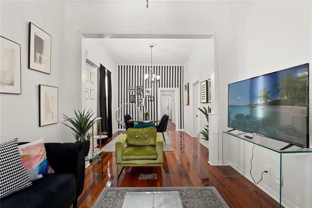 a living room with furniture and a flat screen tv