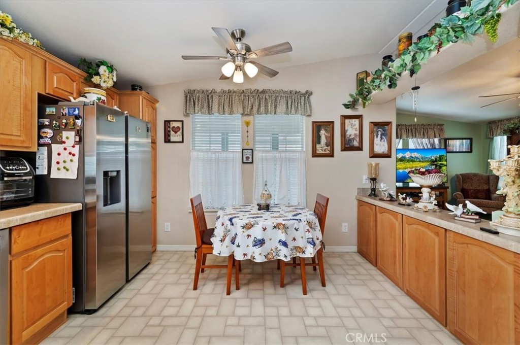 31130 South General Kearny Road, Unit 147 Temecula, CA 92591 - Photo 2 of 42 a kitchen with stainless steel appliances kitchen island granite countertop a refrigerator and a sink